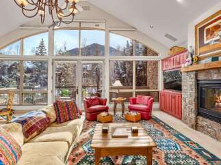 Experience the epitome of luxury living in this stunning property, boasting breathtaking mountain views through expansive windows.