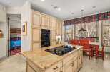 This stunning kitchen boasts a spacious island with a gas cooktop, perfect for culinary enthusiasts.