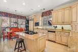 This stunning kitchen boasts a warm and inviting atmosphere, perfect for culinary creations and gatherings.