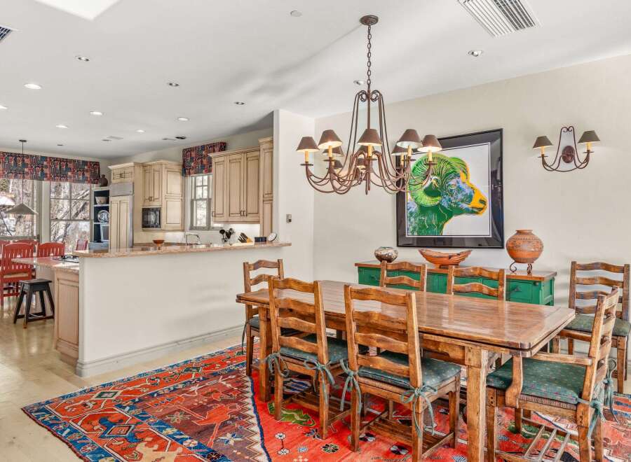 This stunning dining room showcases a beautiful blend of rustic charm and modern elegance.