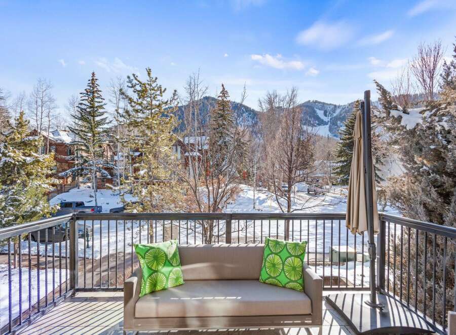 Enjoy breathtaking mountain views from this luxurious balcony.