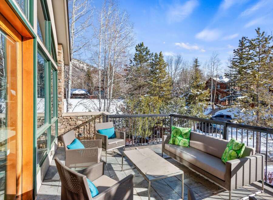 Enjoy breathtaking mountain views from this luxurious outdoor patio.