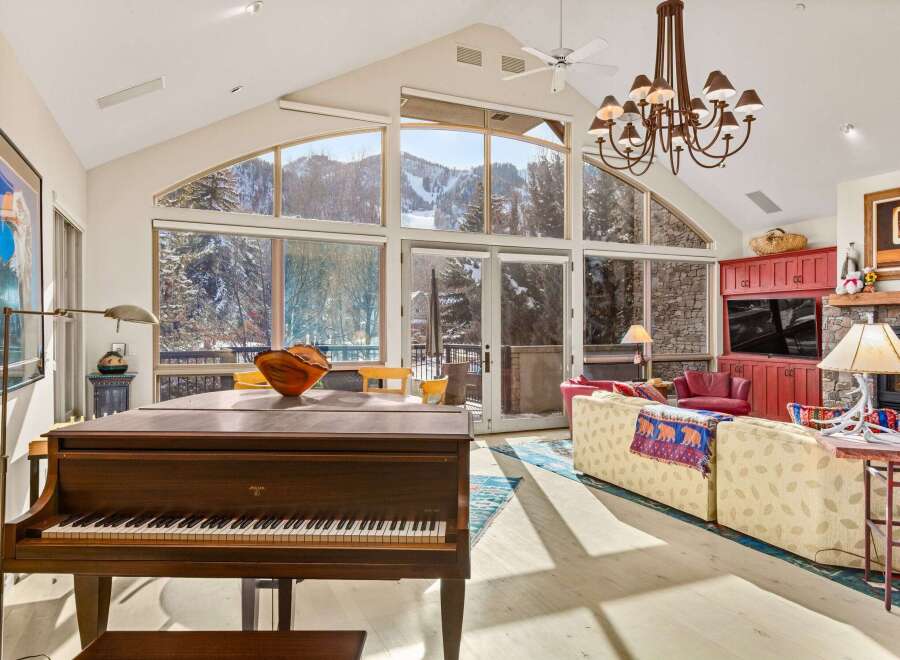 This stunning property boasts a grand piano, perfect for entertaining guests or enjoying a relaxing evening.