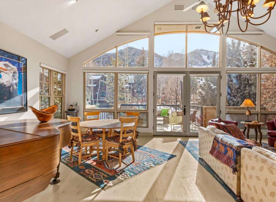 Experience luxury living in this stunning property, featuring breathtaking mountain views through expansive windows.