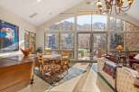 Experience luxury living in this stunning property, featuring breathtaking mountain views through expansive windows.