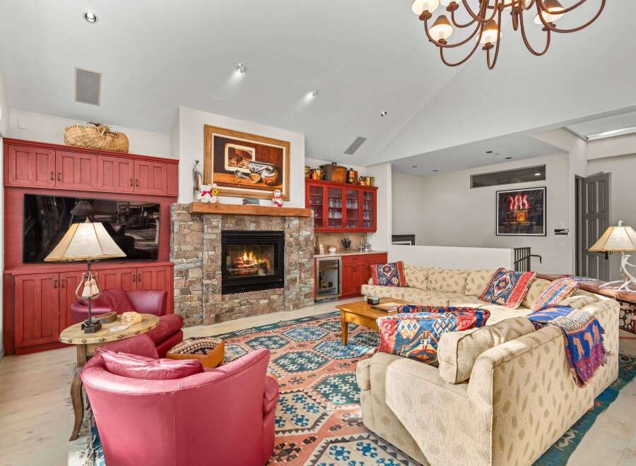 This stunning living room boasts a cozy fireplace, perfect for chilly evenings.