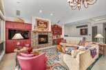 This stunning living room boasts a cozy fireplace, perfect for chilly evenings.