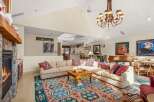 Step into luxury with this stunning living space, featuring a cozy fireplace and a stylish sectional sofa.