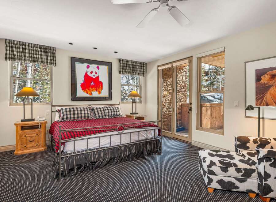 This stunning bedroom features a cozy and inviting atmosphere, perfect for relaxation.