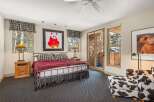 This stunning bedroom features a cozy and inviting atmosphere, perfect for relaxation.