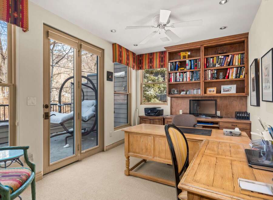 This stunning home office boasts a warm and inviting atmosphere, perfect for productivity and focus.