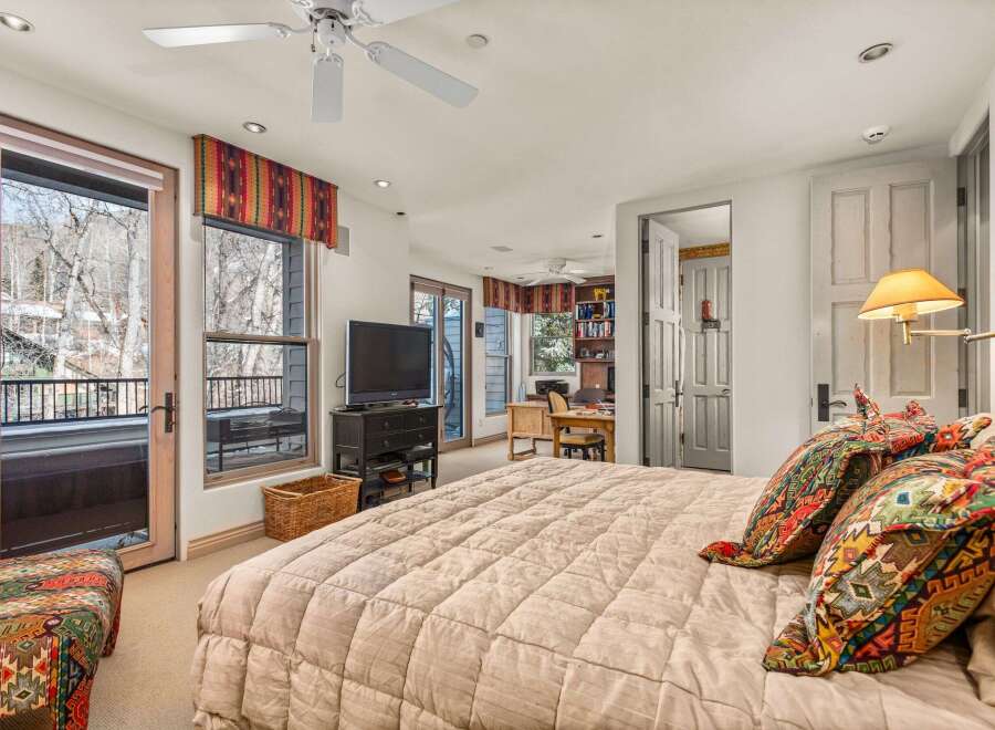 Step into luxury with this stunning bedroom featuring a cozy bed, perfect for relaxation.