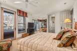 Step into luxury with this stunning bedroom featuring a cozy bed, perfect for relaxation.