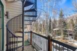 Enjoy stunning views from this property featuring a unique spiral staircase and a private balcony.