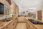 This stunning kitchen boasts a spacious layout and high-end finishes, perfect for culinary enthusiasts.