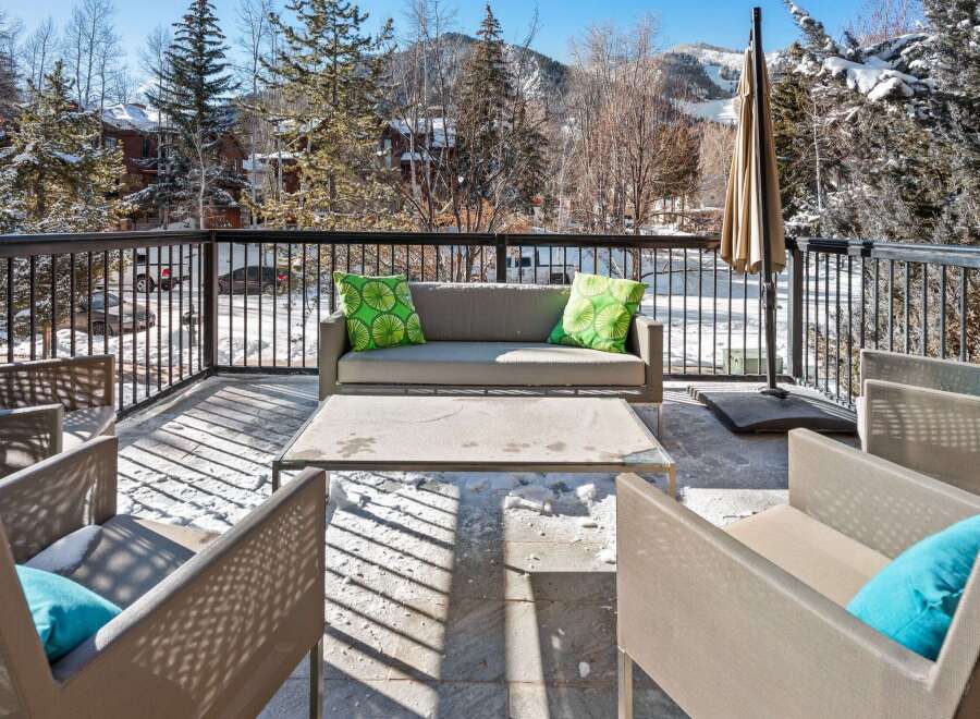 Enjoy breathtaking mountain views from this luxurious outdoor patio.