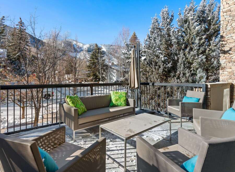 Enjoy breathtaking mountain views from this luxurious outdoor patio.