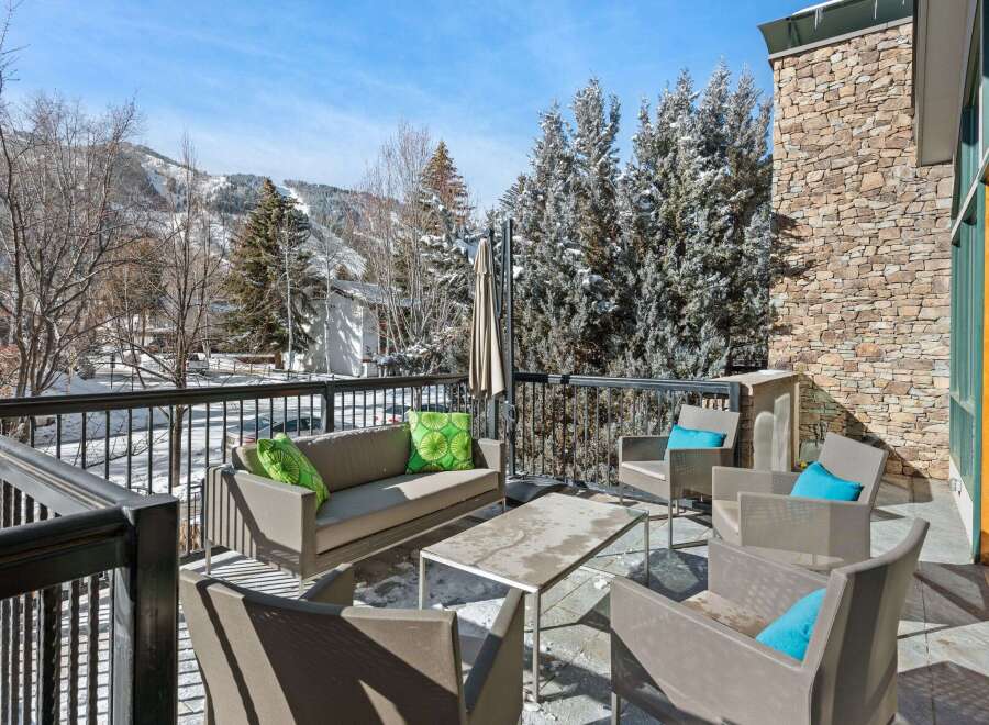 Enjoy breathtaking mountain views from this luxurious outdoor patio.