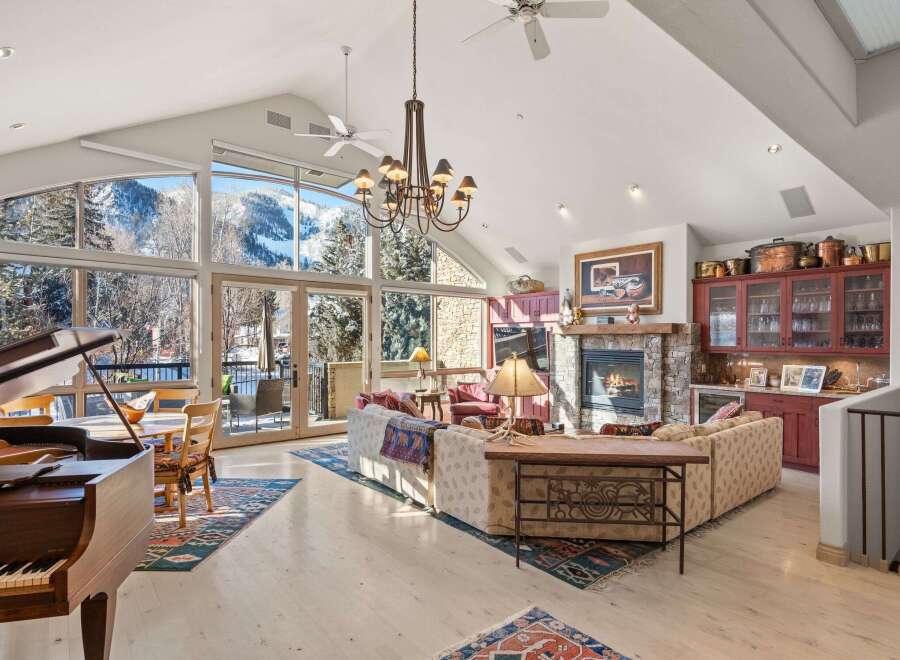 Experience luxury living in this stunning property, featuring breathtaking mountain views through expansive windows.