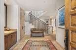 Step into luxury with this stunning entryway, showcasing a grand staircase and exquisite design.