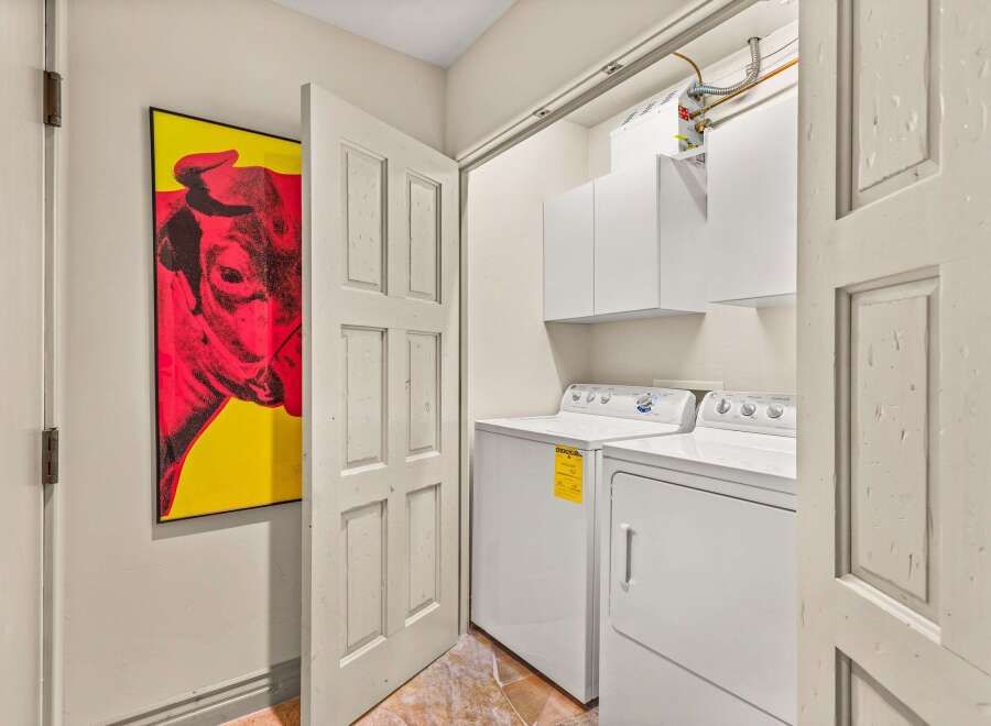 This laundry room offers both functionality and style.