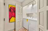 This laundry room offers both functionality and style.