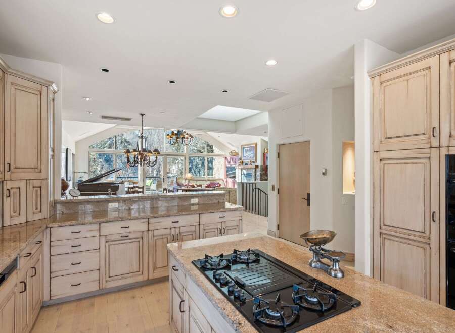 This stunning kitchen boasts a spacious layout, perfect for culinary enthusiasts and entertaining guests.