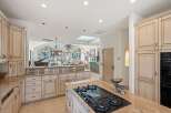 This stunning kitchen boasts a spacious layout, perfect for culinary enthusiasts and entertaining guests.