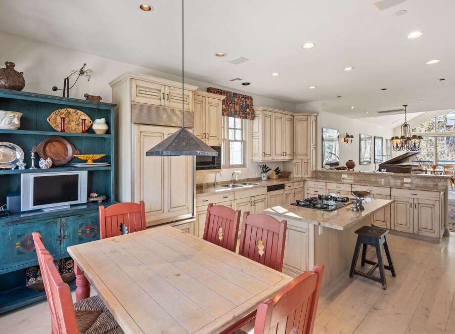This stunning kitchen boasts a blend of rustic charm and modern amenities.