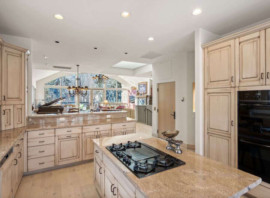 Step into luxury with this stunning kitchen, boasting exquisite cabinetry and a spacious layout perfect for culinary enthusiasts.