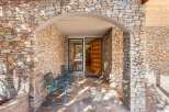 This stunning property boasts a beautiful stone facade, creating a warm and inviting curb appeal.