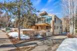This stunning property boasts a modern architectural design with a blend of stone and sleek lines.