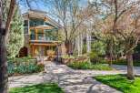 Experience luxury living in this stunning home, featuring a spacious balcony with an umbrella for outdoor relaxation and expansive windows that flood the interior with natural light.
