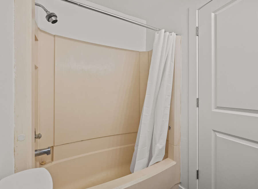 Step into this inviting bathroom, featuring a clean and well-maintained shower area.
