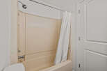 Step into this inviting bathroom, featuring a clean and well-maintained shower area.