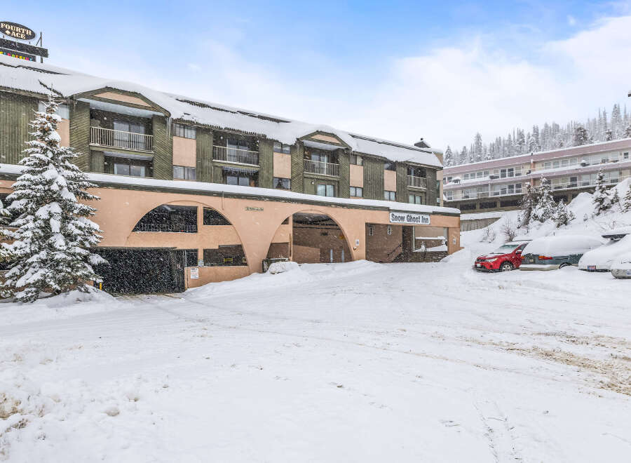 Nestled in a winter wonderland, this property offers a cozy retreat with stunning views.
