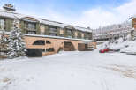 Nestled in a winter wonderland, this property offers a cozy retreat with stunning views.