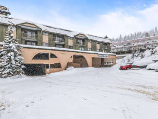Nestled in a winter wonderland, this property offers a cozy retreat with stunning views.