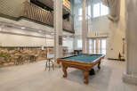 This spacious property features a well-lit game room, perfect for entertainment.