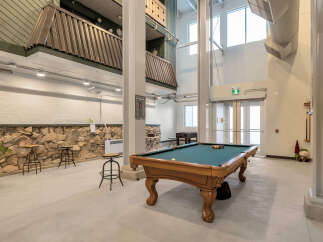 This spacious property features a well-lit game room, perfect for entertainment.
