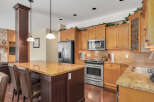 This stunning kitchen boasts a warm and inviting atmosphere, perfect for both everyday living and entertaining.