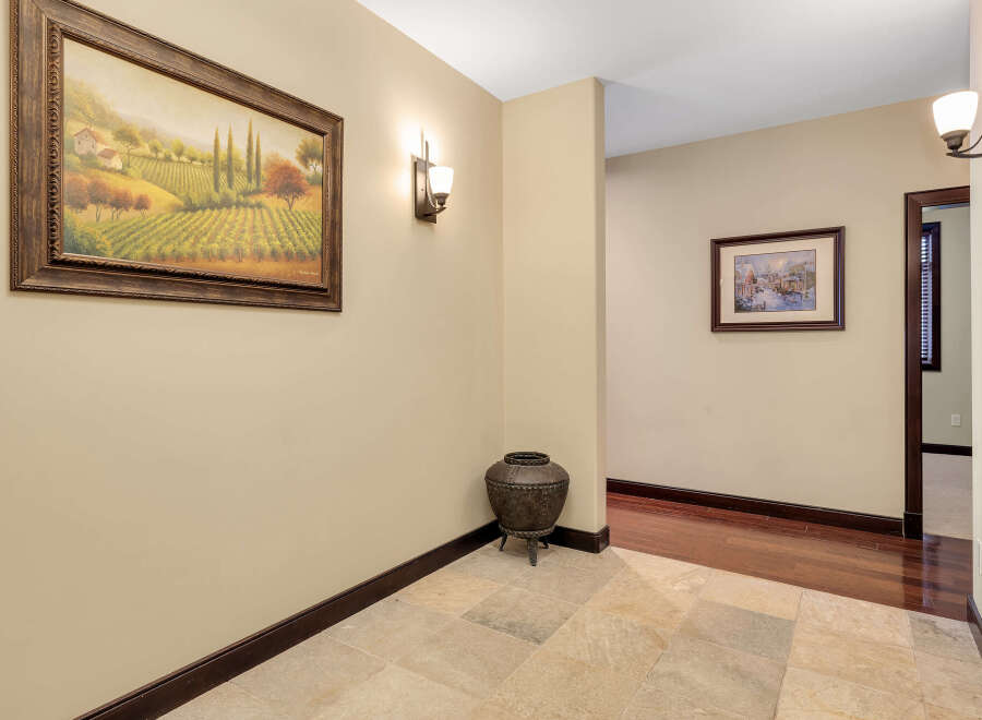 Step into this inviting entryway, showcasing a blend of elegance and warmth.