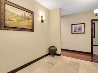 Step into this inviting entryway, showcasing a blend of elegance and warmth.