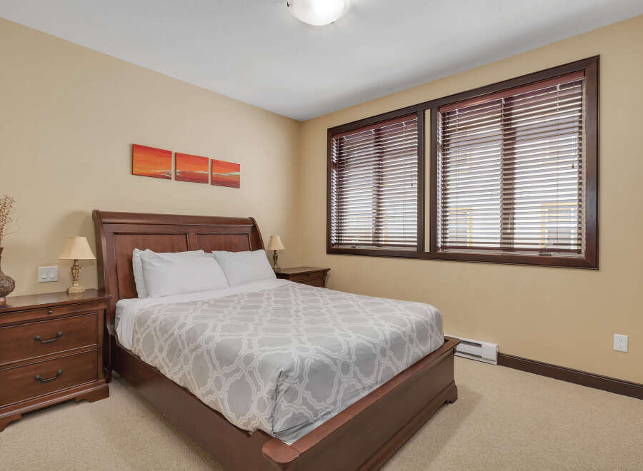 This inviting bedroom features a comfortable bed, perfect for a relaxing retreat.