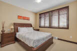 This inviting bedroom features a comfortable bed, perfect for a relaxing retreat.