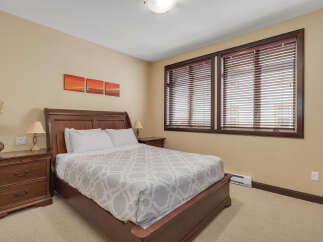 This inviting bedroom features a comfortable bed, perfect for a relaxing retreat.
