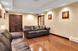 This stunning living room boasts a luxurious leather sofa, perfect for relaxing and entertaining.