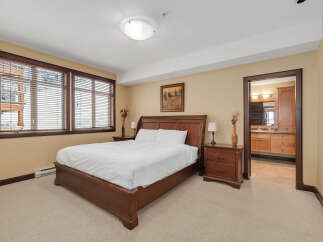 This stunning bedroom boasts a cozy and inviting atmosphere, perfect for relaxation.