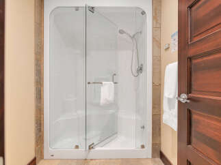 Step into luxury with this stunning bathroom featuring a modern glass shower.