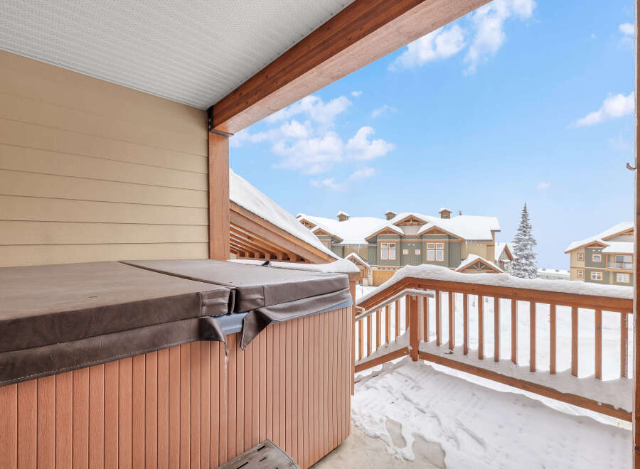 Enjoy the ultimate relaxation in this stunning property featuring a private hot tub, perfect for unwinding after a day on the slopes.